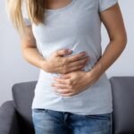 Young slim woman enjoys weight loss result